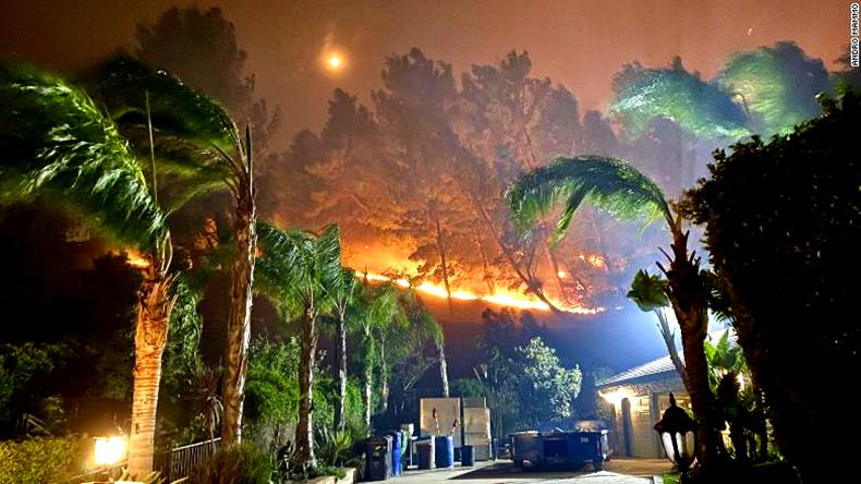 A photo taken by Andro Mammo shows the Porter Ranch neighborhood in Los Angeles engulfed in flames.