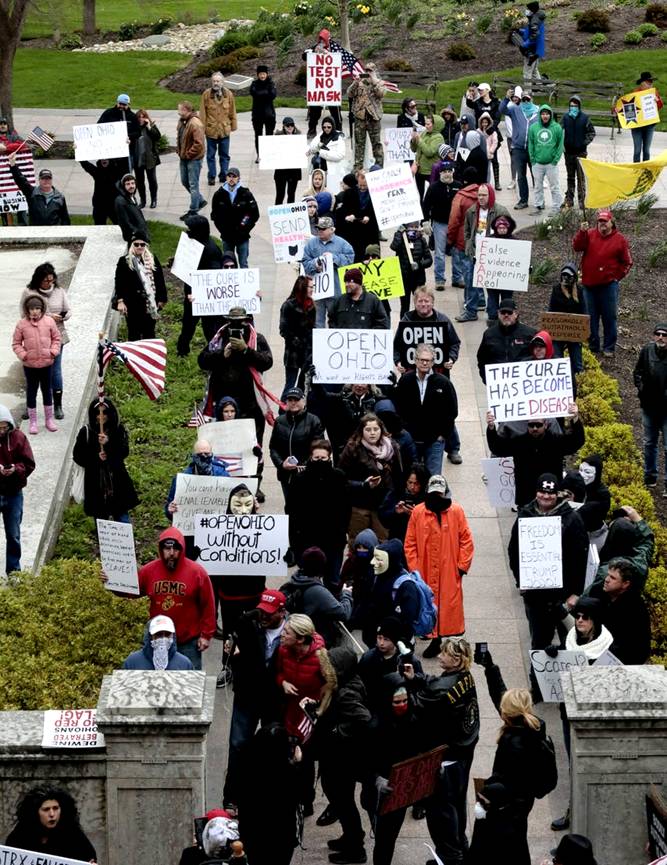 Protesters stand outside the Ohio Statehouse during the State of Ohio's Coronavirus response update on April 13, 2020 in Columbus, Ohio.