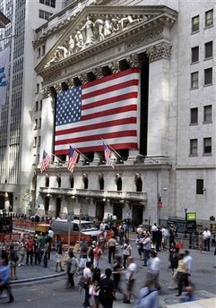 People walk past the New York Stock Exchange September 15, 2008. ...