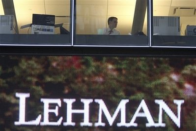 A man looks out the window at the Lehman Brothers headquarters ...