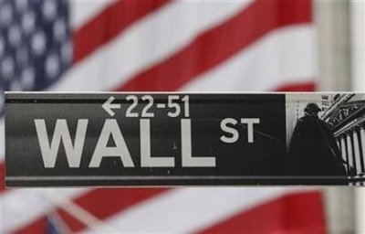 The Wall Street sign is seen in front of the New York Stock ...