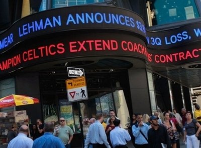 A ticker sign announces losses at troubled bank Lehman Brothers ...