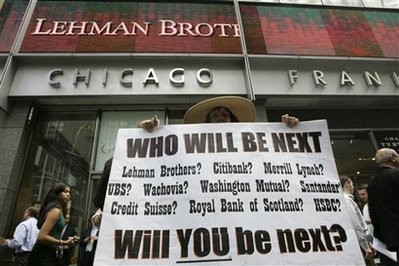 Robin Radaetz holds a sign in front of the Lehman Brothers headquarters ...