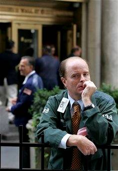 Stock broker Andrew O'Connor takes a break from his floor position ...