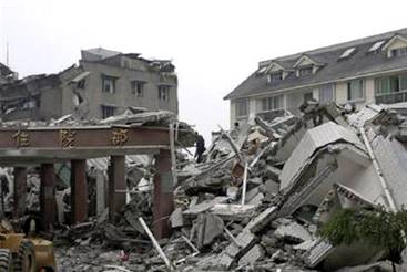 A general view shows a collapsed hospital after an earthquake ...