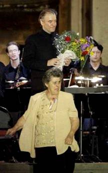Russian conductor Valery Gergiev receives flowers from a woman ...
