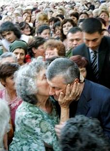 A woman kisses South Ossetian leader Eduard Kokoity, right, ...