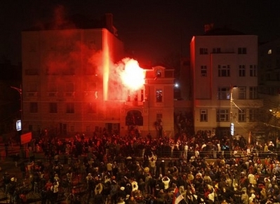 The U.S. embassy in Belgrade burns after masked attackers broke ...