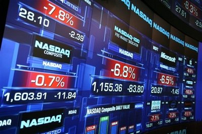Stock prices are shown at the Nasdaq MarketSite before the start ...