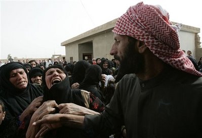 The mother of Syrian Faysal el-Abdallah, second left, mourns ...