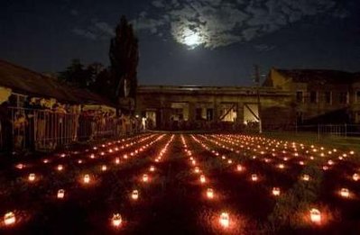 People mourn in the compound of the Beslan school, September ...