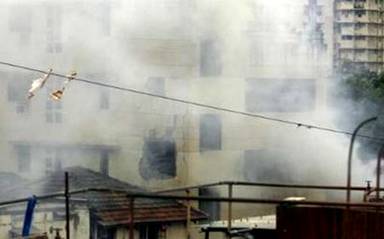 Smoke rises after an explosion on the fourth floor of the Nariman ...