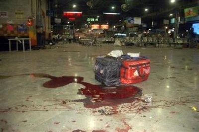 Luggages are seen near a pool of blood after shootings by unidentified ...