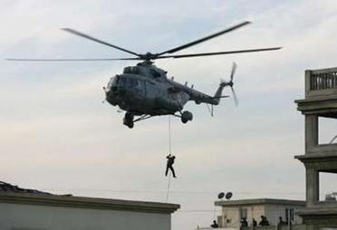 Indian National security Guard (NSG) commandos rappel down from ...