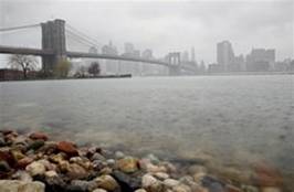 Rain falls on the East River near the Brooklyn Bridge, left, in the Brooklyn borough of New York on Sunday, April 15, 2007.
 Peter Morgan -- AP Photo