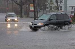 Vehicles drive through flooded streets during a spring storm in Huntington, New York, Sunday, April 15, 2007
 Ed Betz -- AP Photo