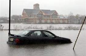 A car abandoned by the driver sits in water up to its bumpers that overflowed the banks of the Cooper River along South Park Drive, Sunday, April 15, 2007, in Collingswood, N.J. In the background is the new boathouse. A major nor'easter predicted to be the region's worst storm in 15 years pounded New Jersey on Sunday with heavy rain and high winds, causing hundreds of flight cancellations and flooding roadways.
 Tom Mihalek -- AP Photo
