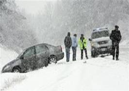 Local police attend to a car that has spun off the road on RTE 9, Sunday April 15, 2007, in Henniker, N.H. A powerful nor'easter pounded the East with wind and pouring rain Sunday, grounding airlines and threatening to create some of the worst coastal flooding in 14 years.
 Cheryl Senter -- AP Photo