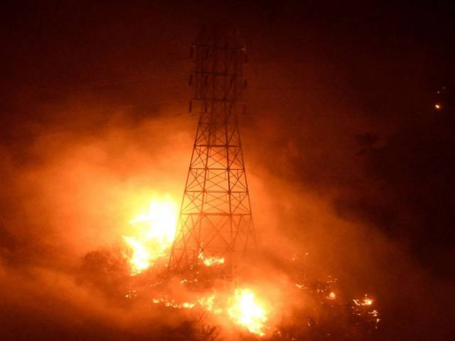 PHOTO: Heavy fire from the Thomas Fire burns around power line towers in Coyote Canyon near Montecito, Calif., Dec. 16, 2017. 