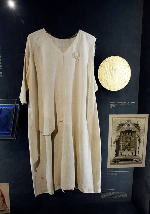The tunic worn by Louis King Louis IX who took part in the crusades and 'acquired' the crown of thorns for France in the 13th-century