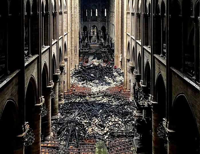 Devastation: A view from the upper balcony inside Notre Dame shows debris strewn across the floor after falling from the ceiling