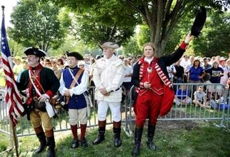 Men wear colonial costumes as thousands gather ...